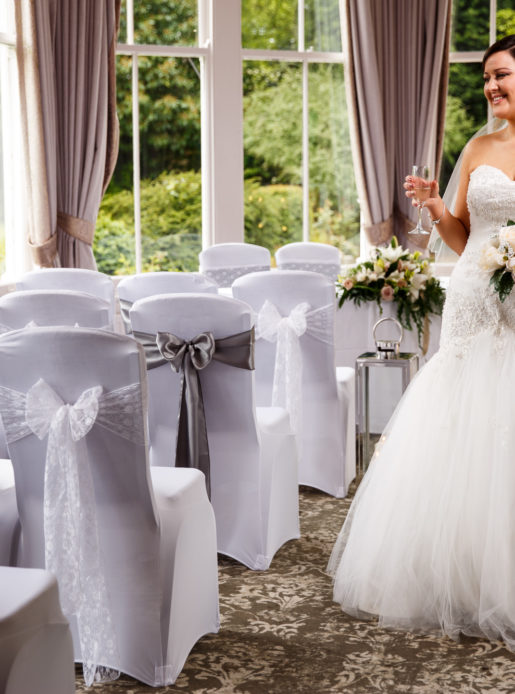 Bride standing in the Conservatory, wedding ceremony
