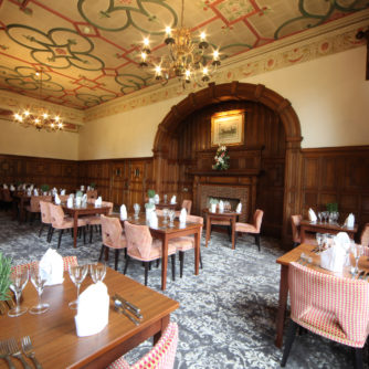 The Folly restaurant at Mercure Burton Upon Trent Newton Park Hotel, wooden panelling, feature fireplace