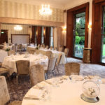 The William Morris Suite at Mercure Burton Upon Trent Newton Park Hotel, set up for a wedding breakfast