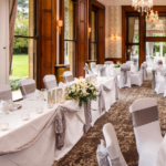 The William Morris Suite at Mercure Burton Upon Trent Newton Park Hotel, set up for a wedding breakfast, top table