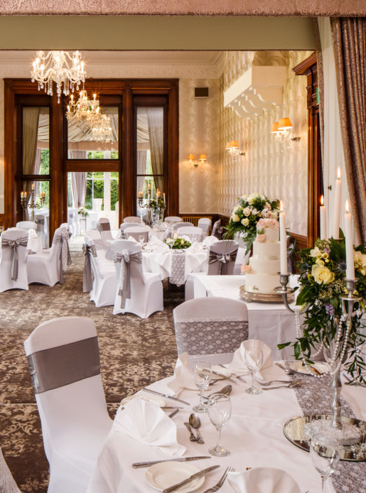The William Morris Suite at Mercure Burton Upon Trent Newton Park Hotel, set up for a wedding breakfast, top table